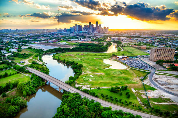 A scenic view of Buffalo Bayou with the Houston skyline in the background.
