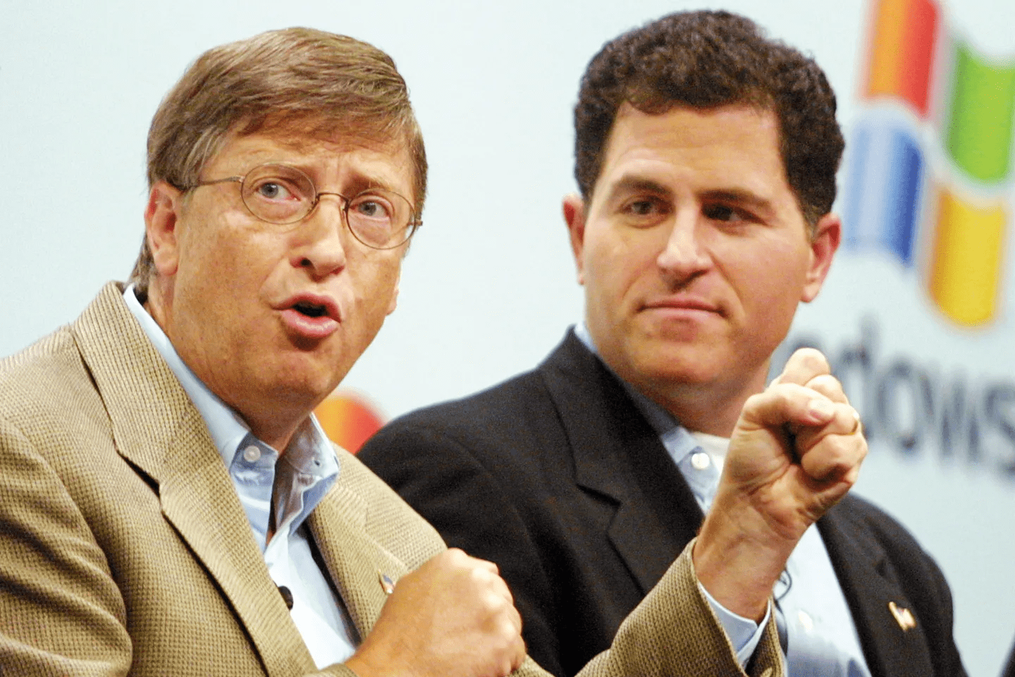 Logos of Dell and Microsoft, representing their competition.