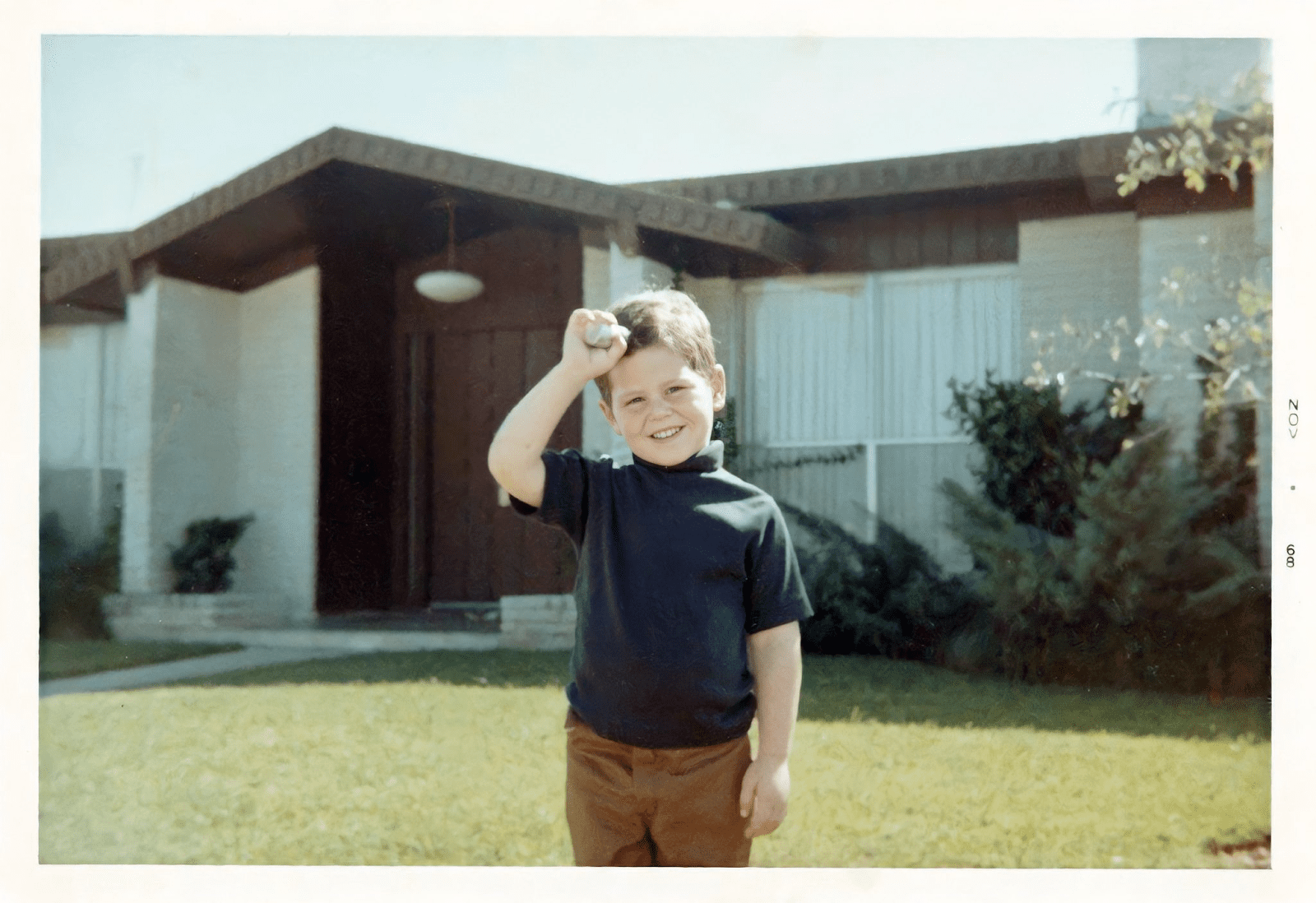 Young Michael Dell with an early model computer.